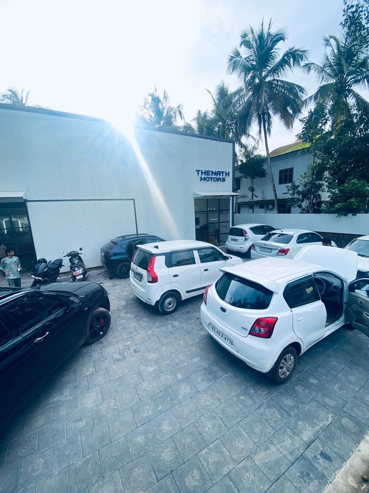 Thenath Motors workshop exterior and customer parking area